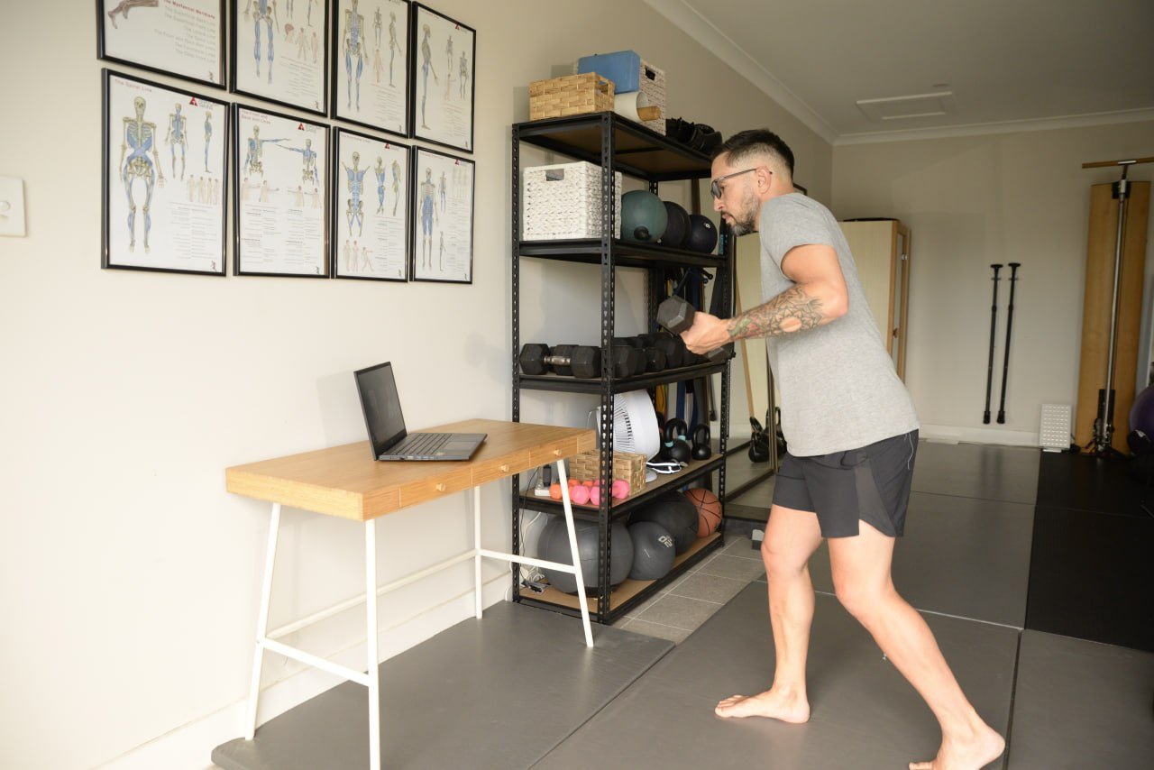 Steve Zekic demonstrating a weighted drill during a live online session